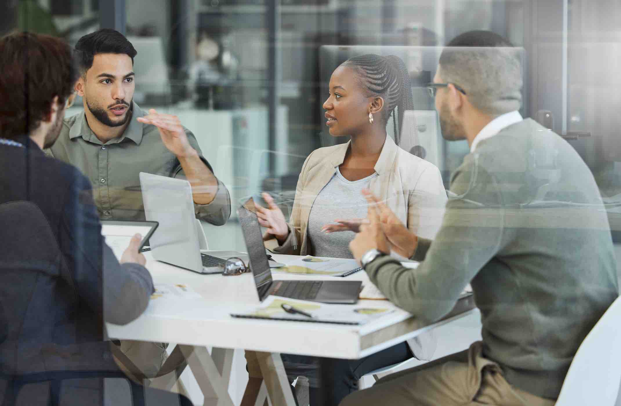 Shot of a group of businesspeople having a meeting in an office at work