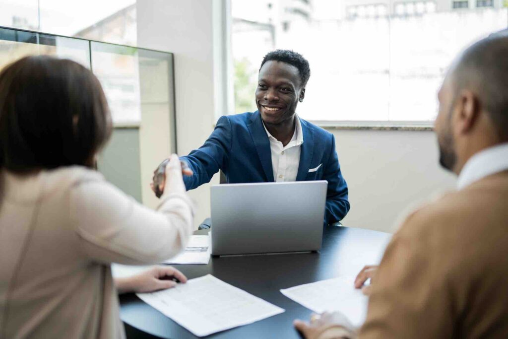 Customer shaking hands with a salesman in Insurance Industry
