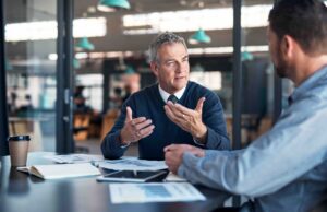 Explaining his vision to a colleague