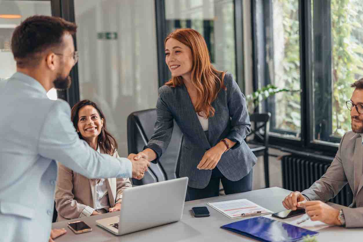 Professional team in business meeting handshake success concept