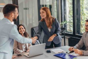 Professional team in business meeting handshake success concept